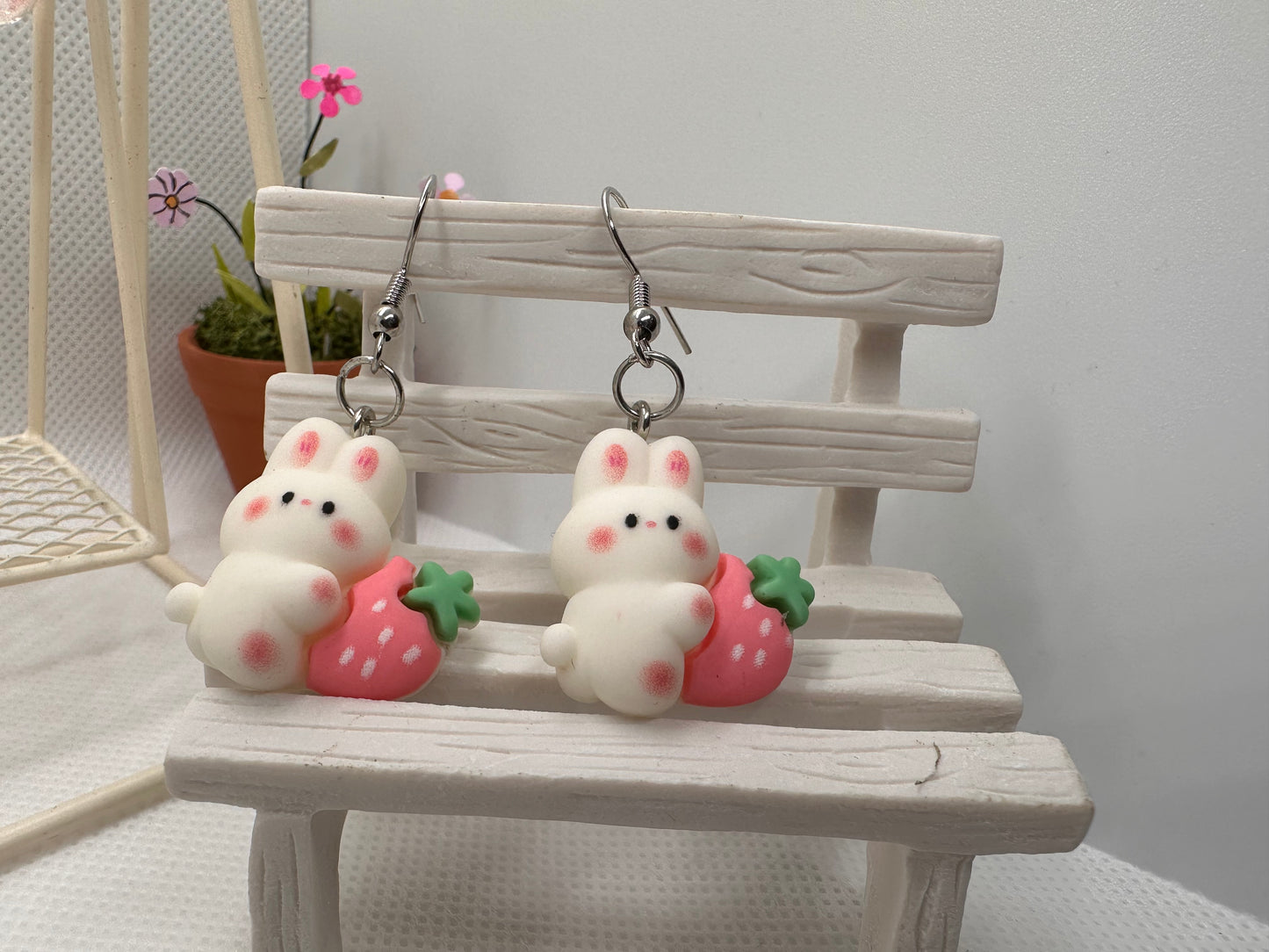 Bunny with pink strawberry earring